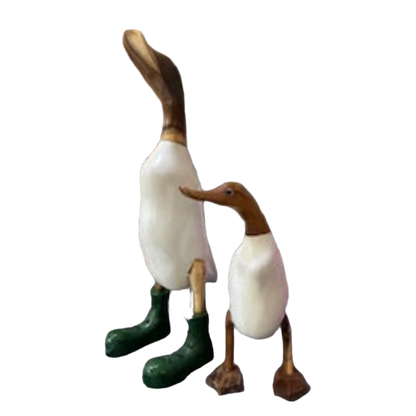 A Wooden Duck With White Body and Webbed Feet