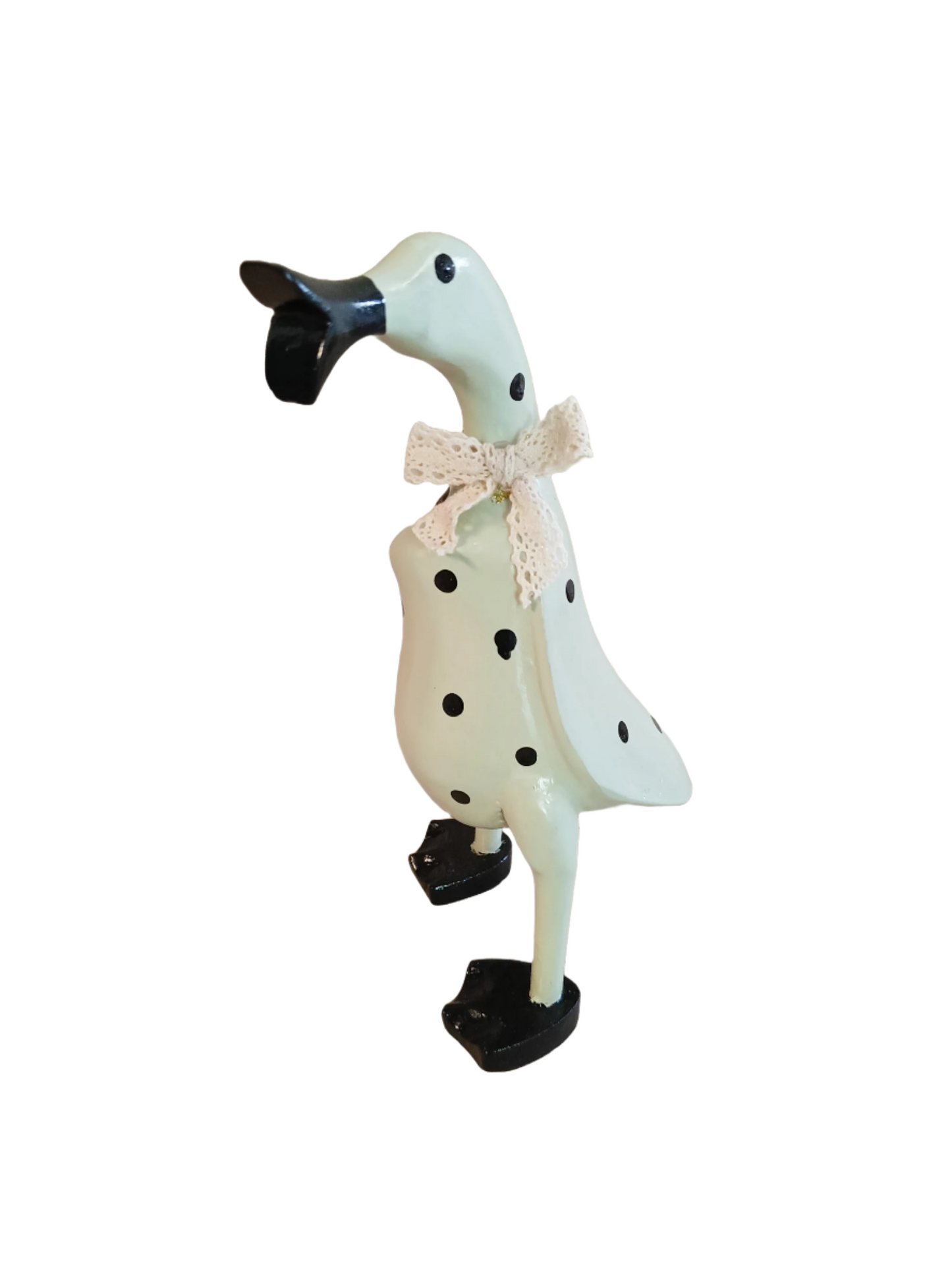 A Wooden Coloured Chatter Duck White With  Black  Polka Dots injured With Marks On the paint work